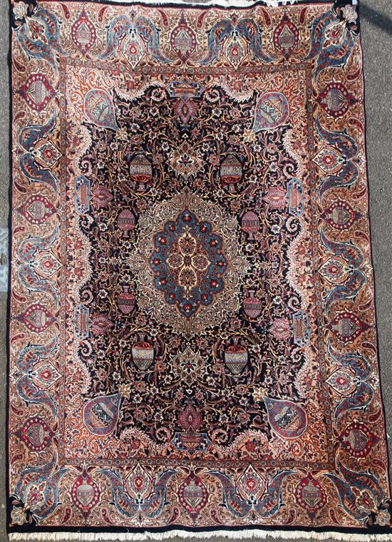 A Persian cream ground carpet, 12ft 10in by 8ft 10in.